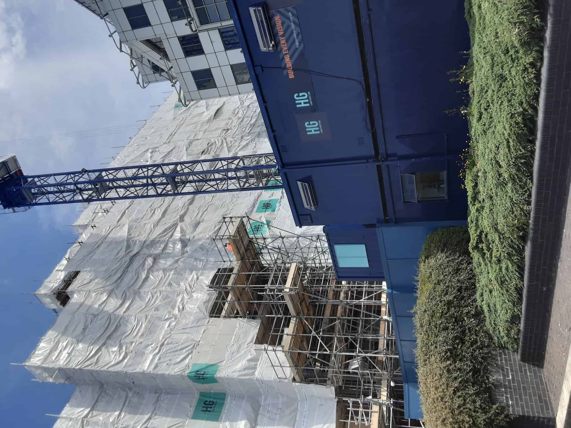Wrapped scaffold on a building under construction